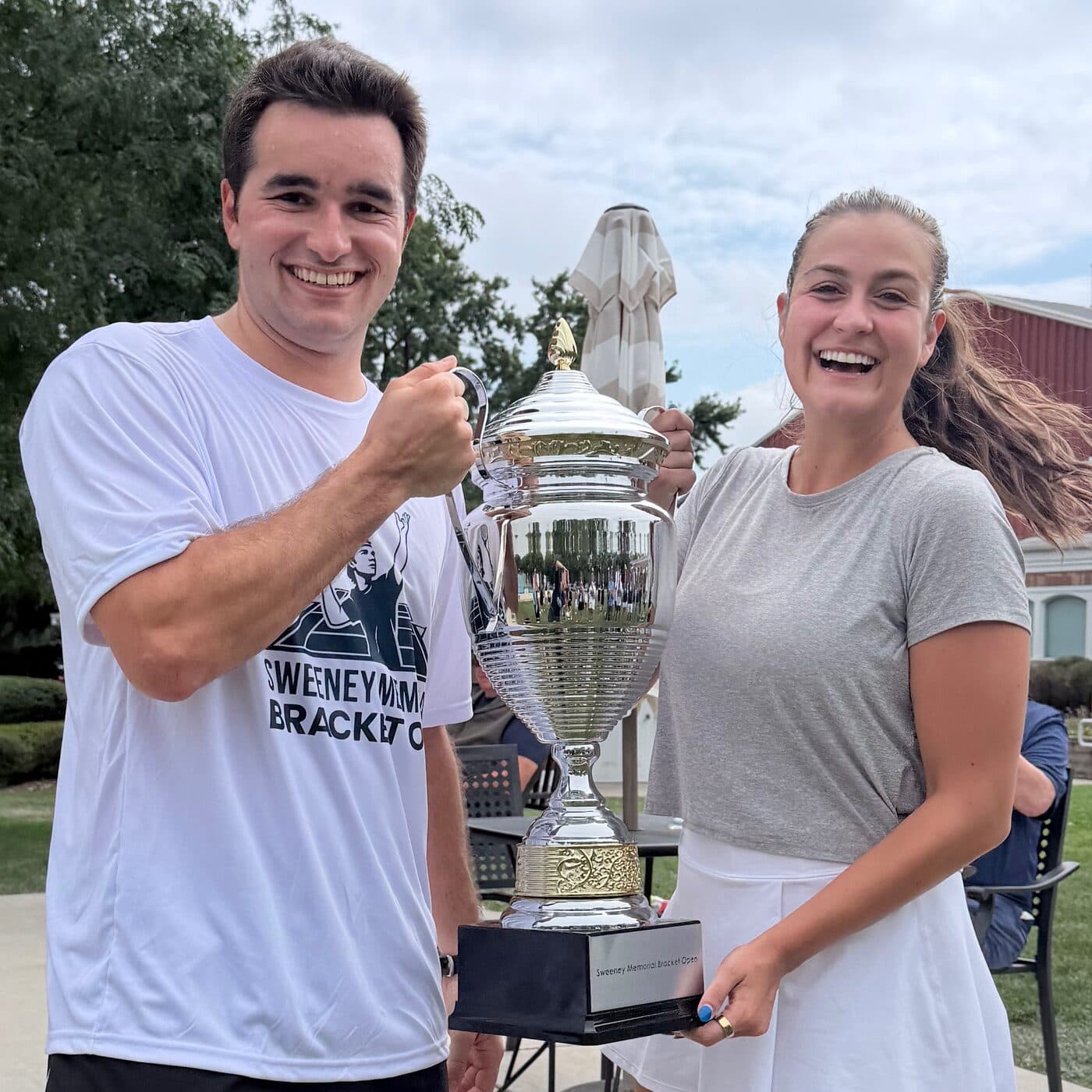 Jack Bernstein and Stefana Vasic holding the Sweeney Memorial Bracket Open trophy