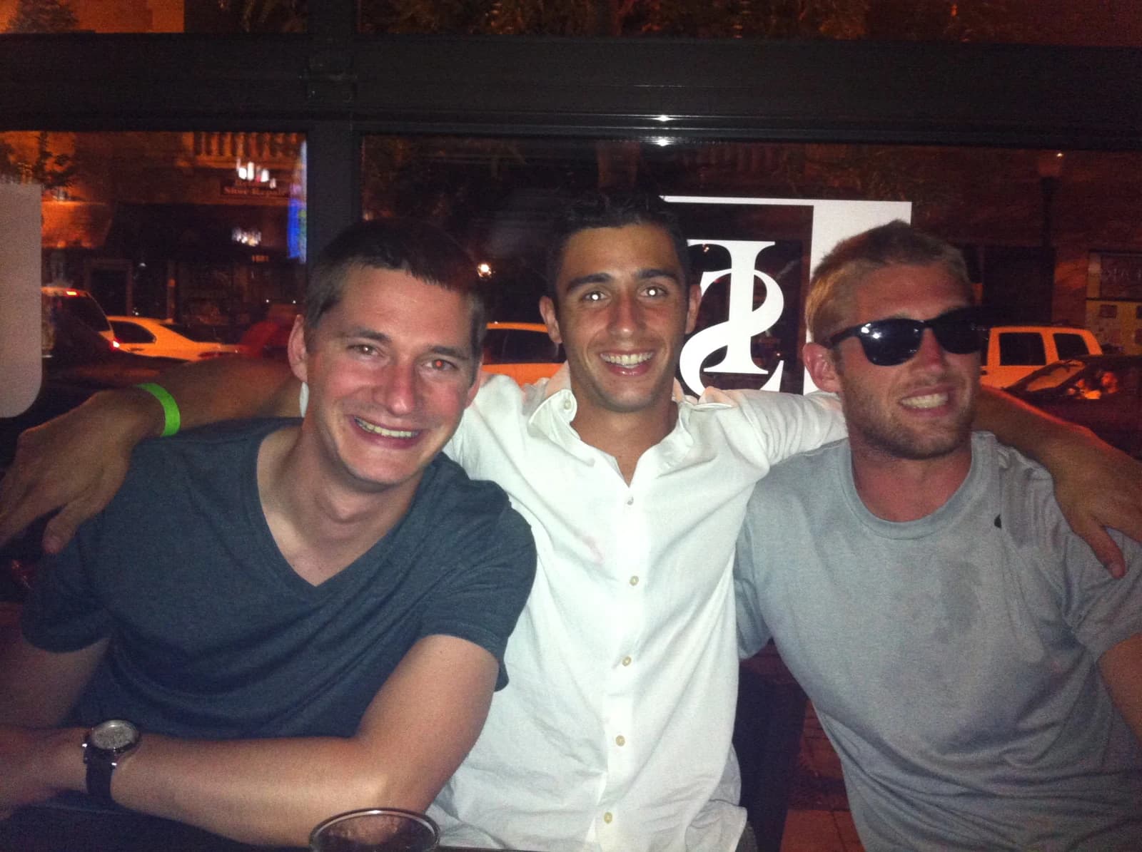 Sam with Bryan and Metro at a downtown bar at night