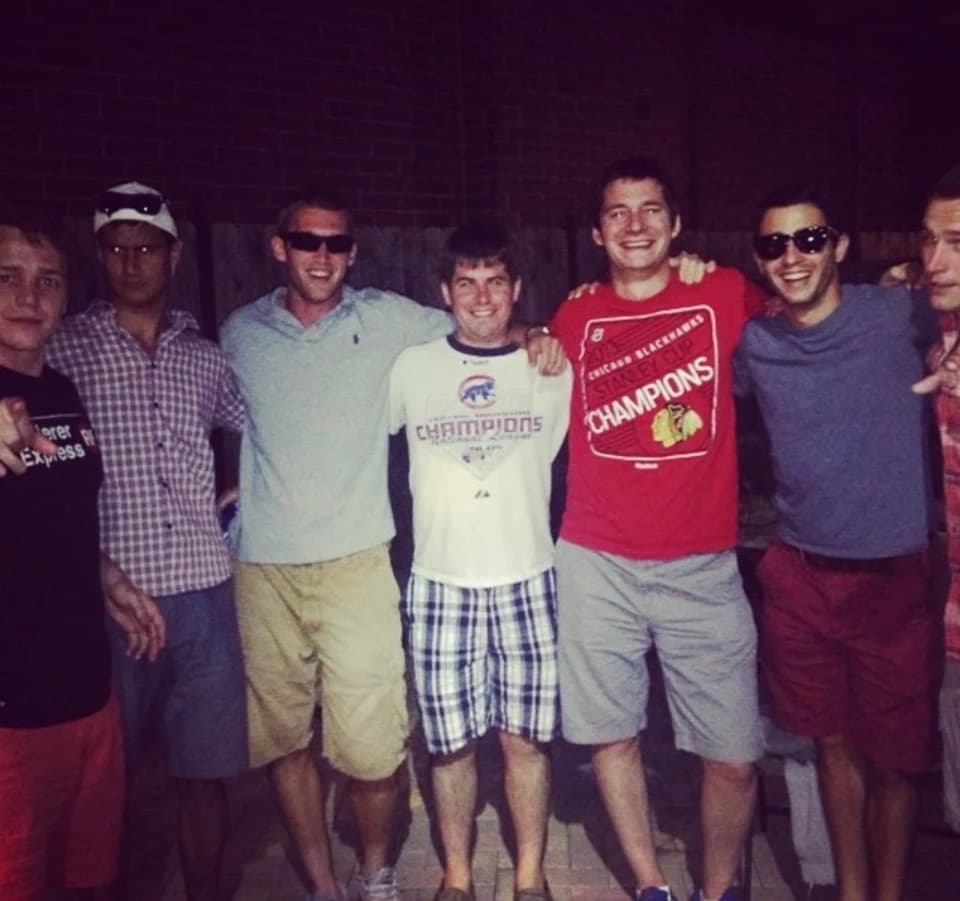 Sam with Gabe, Stump, Metro, Bryan, and Ben outside on a summer night