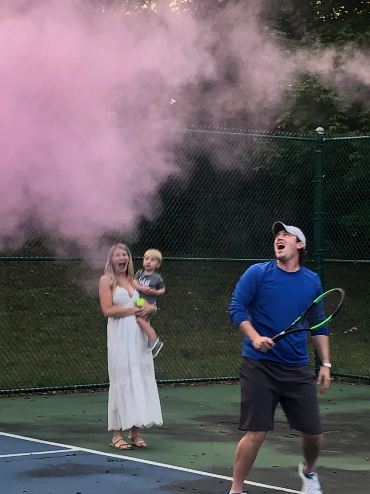 Sam Sweeney with Kellirose and their son at a tennis court gender reveal