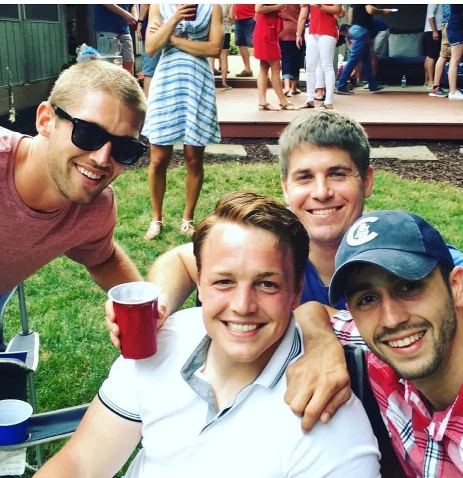 Sam with Gabe, Stump, and Metro at a backyard get-together