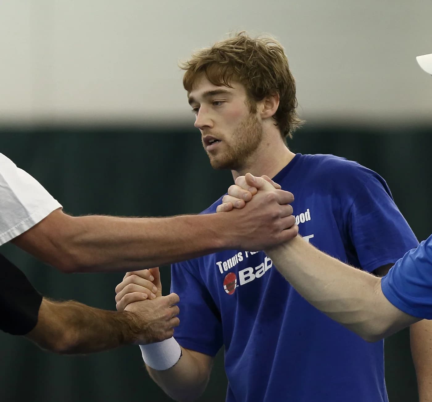 Sam Sweeney shaking hands across the net after an indoor match